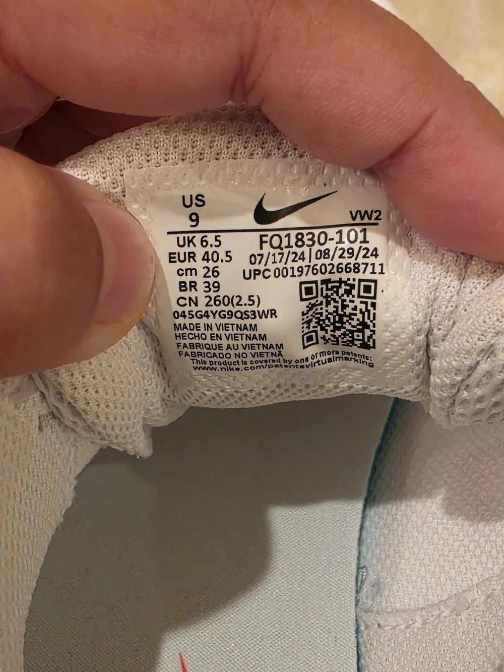 Nike Women's White Athletic Sneakers with Pink Swoosh